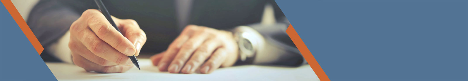 close up of hand writing with a pen