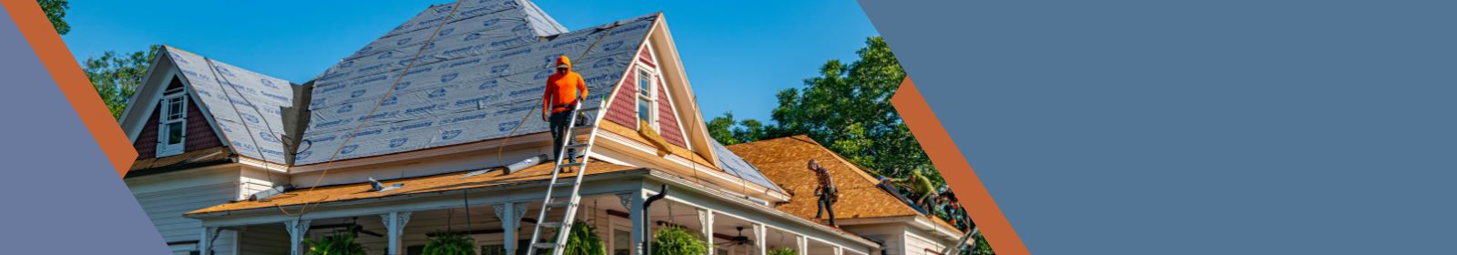 man working on the roof of a house