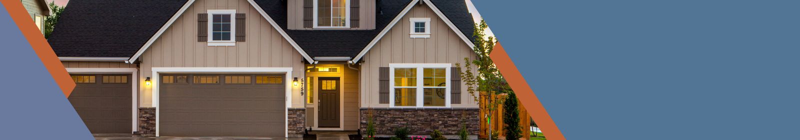 house at dusk with outside lights on